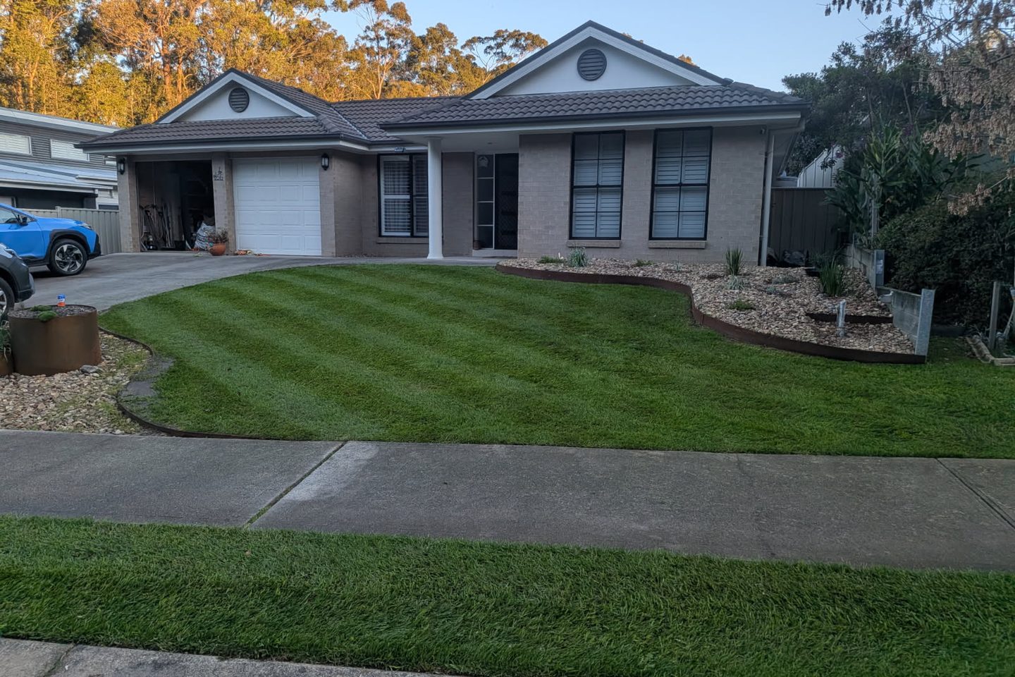 Professional lawn mowing at a residential property