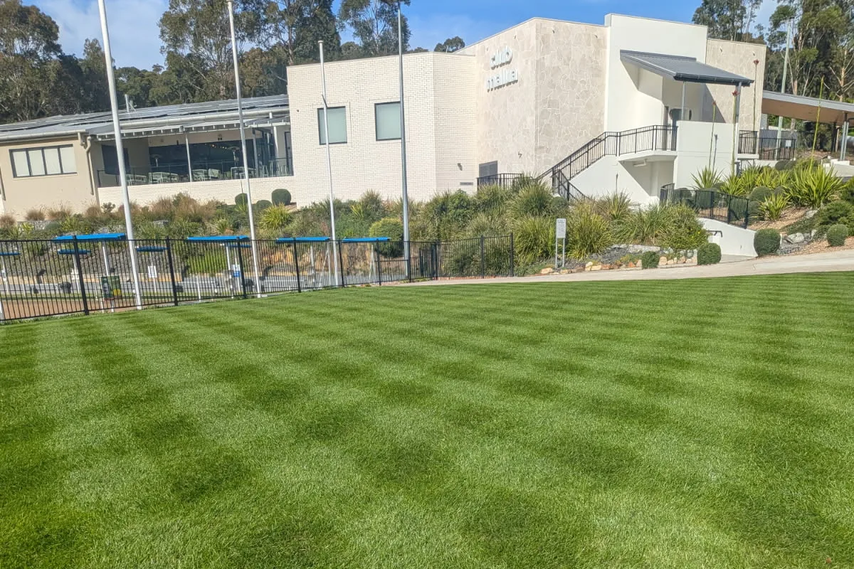 Striped bowls green in front of clubhouse